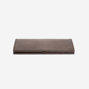 a dark brown leather wallet lying closed on a flat white surface