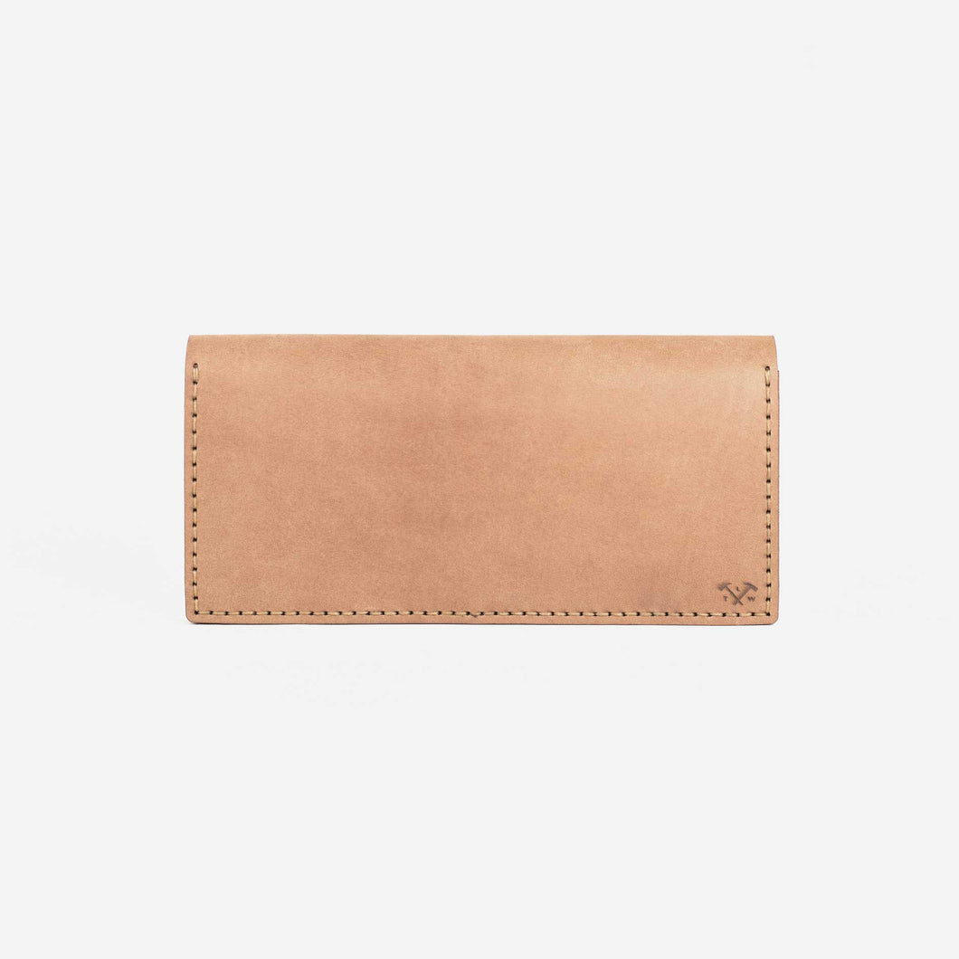 a natural tan leather wallet with hand stitching and etched logo details. 