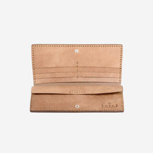 An open natural tan leather wallet with hand stitching, metal hardware, and etched logo details. 