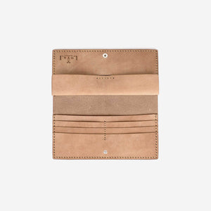 An open natural tan leather wallet with many internal pockets, hand stitching, metal hardware, and etched logo details. 