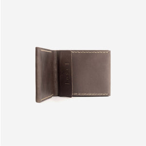 a rich brown leather wallet lying on its side with an interior pocket, etched logo and hand stitched detailing